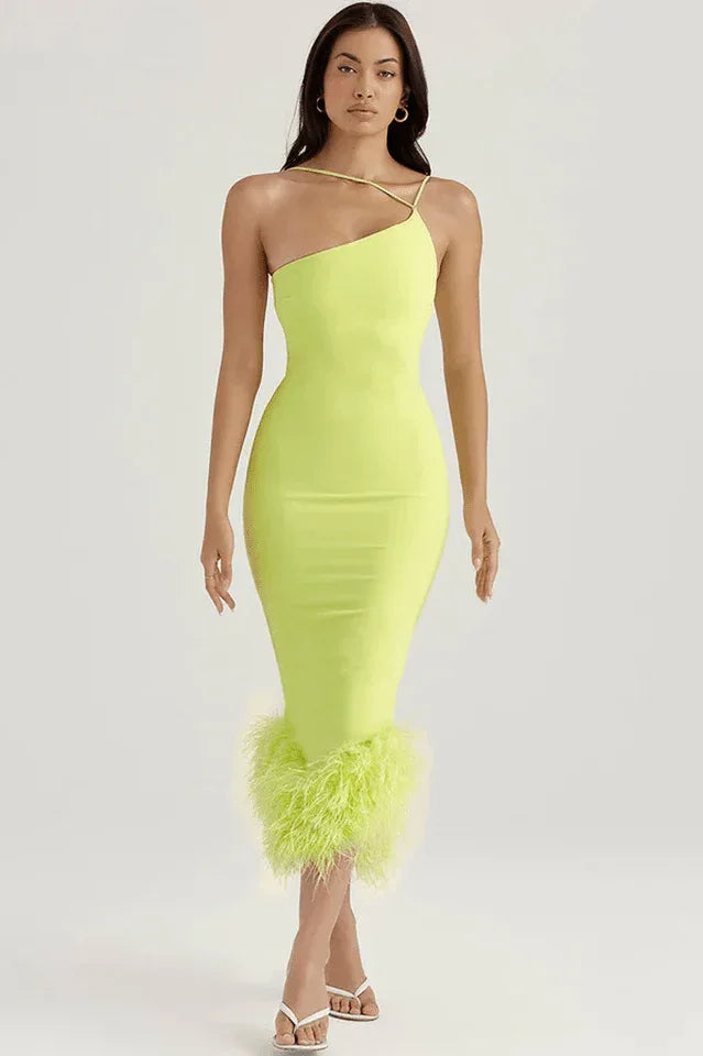 Woman wearing a lime green one-shoulder bodycon dress with feather trim hem
