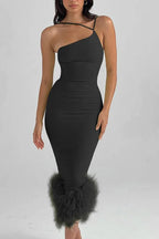 Close-up of the black one-shoulder bodycon dress with feather trim hem