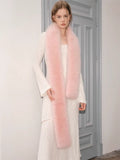 Close-up of the white textured knit dress and pink faux fur scarf