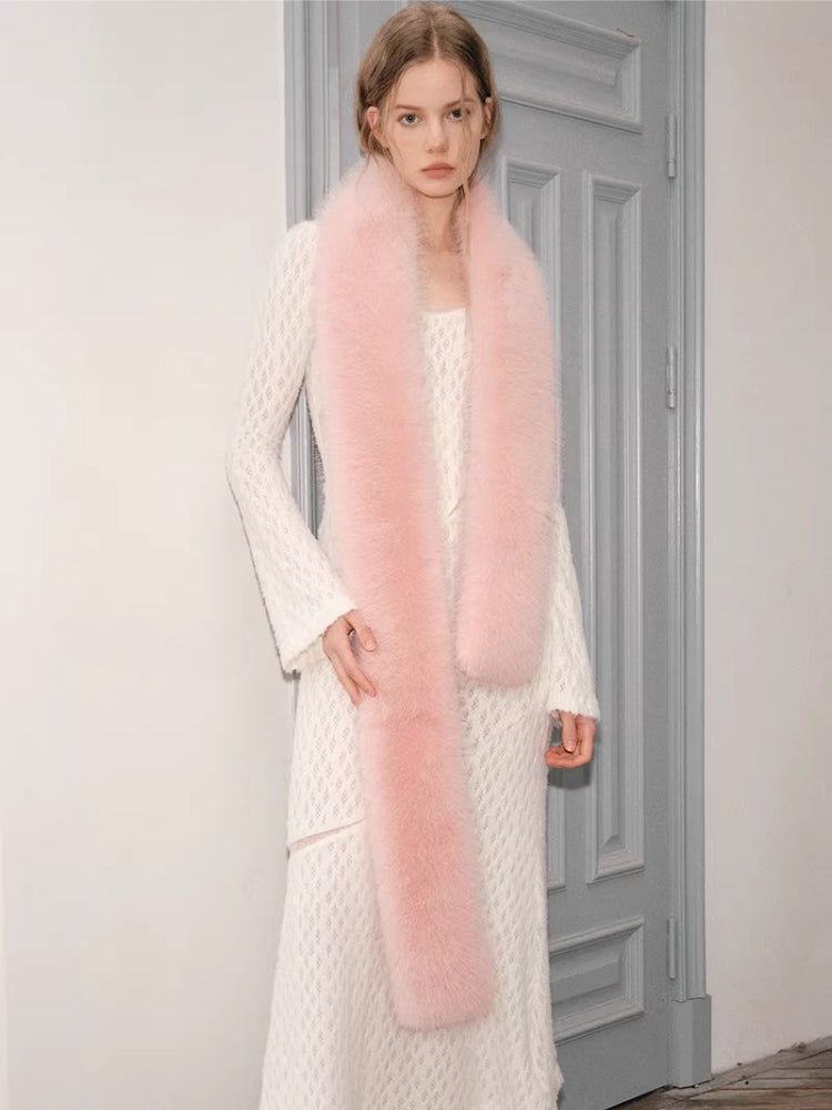 Close-up of the white textured knit dress and pink faux fur scarf
