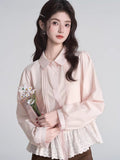 Woman holding a bouquet of white flowers while wearing a pink peplum blouse.