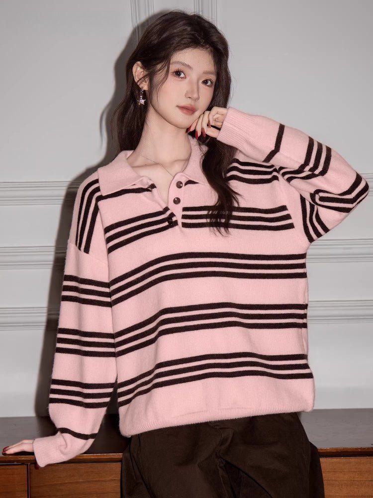 Woman modeling a pink and brown striped polo sweater