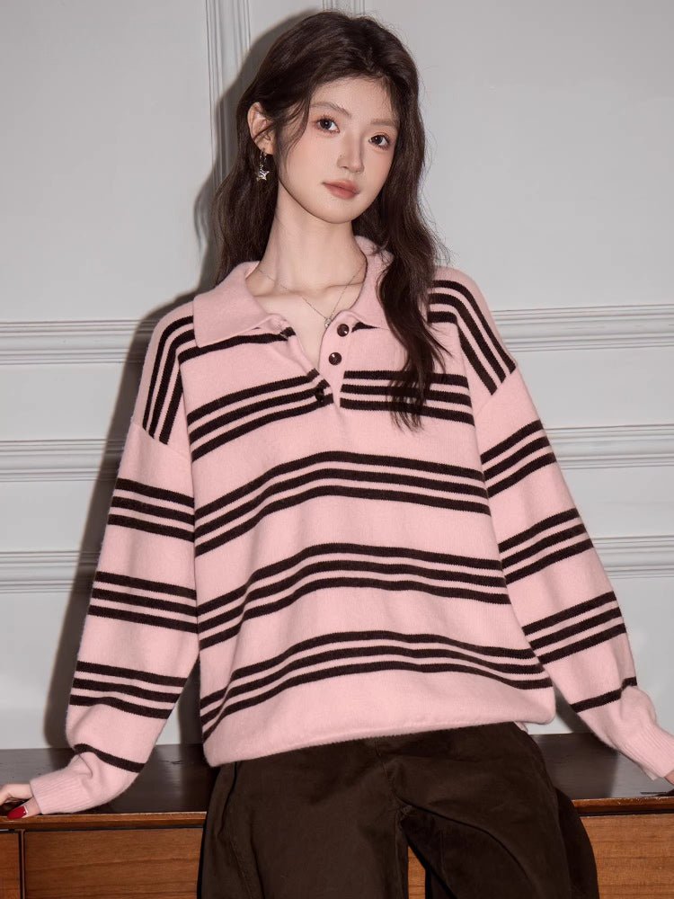 Woman posing in a pink and brown striped polo sweater