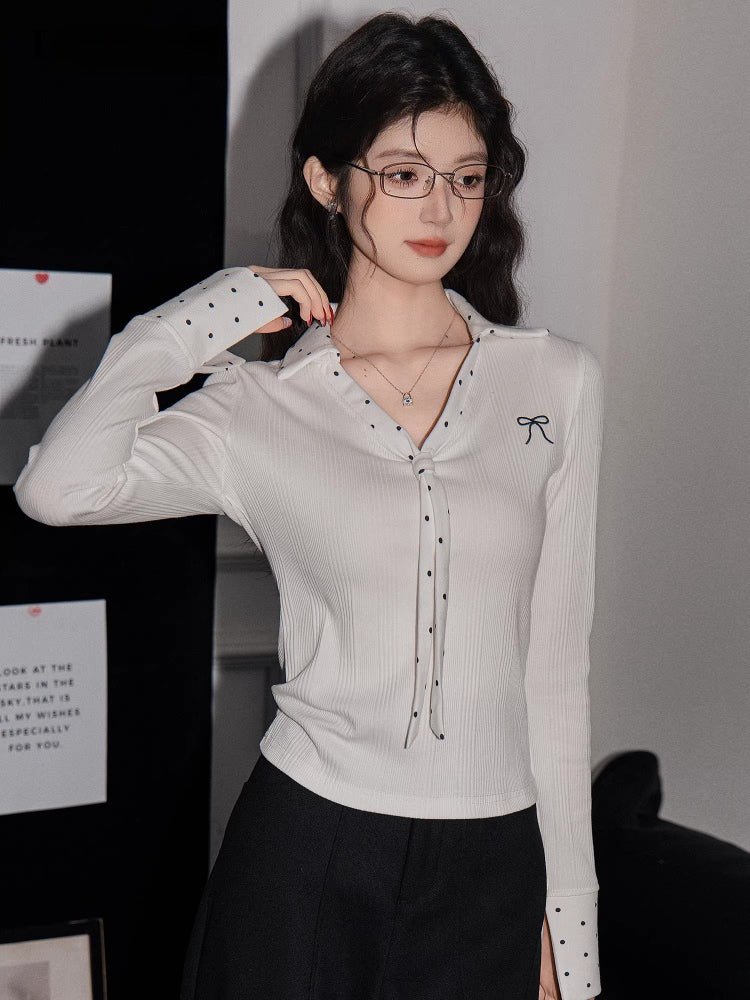 Side profile of the woman, showcasing the fitted silhouette of the white shirt.