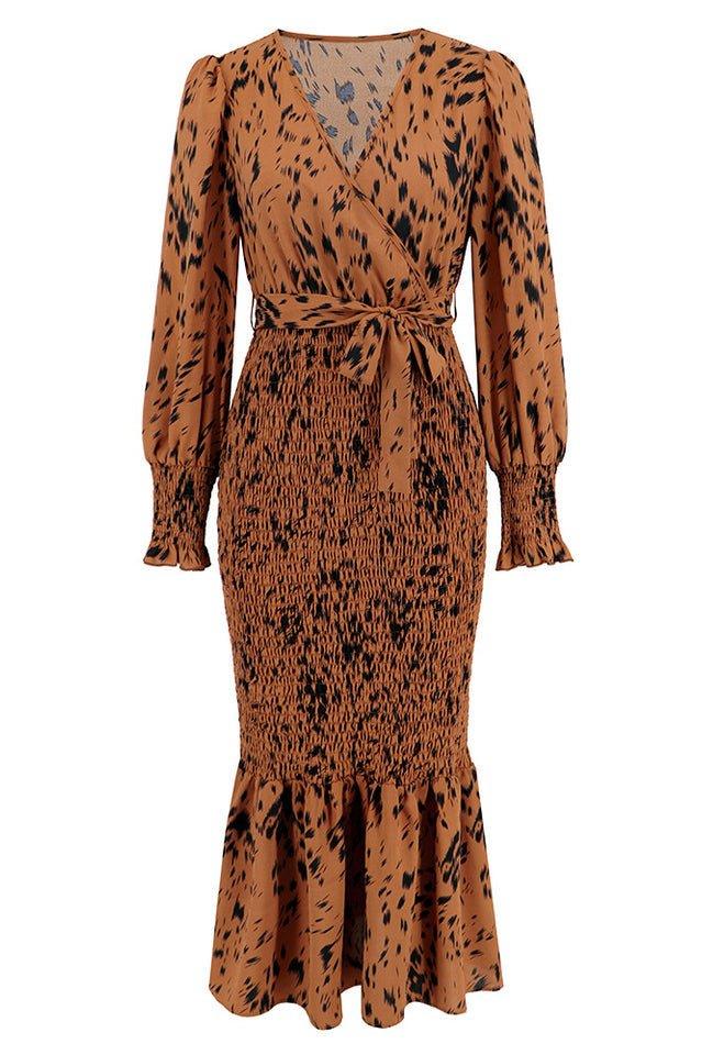 product shot of a brown and black leopard print long sleeve smocked midi dress with a tie waist and ruffled hem