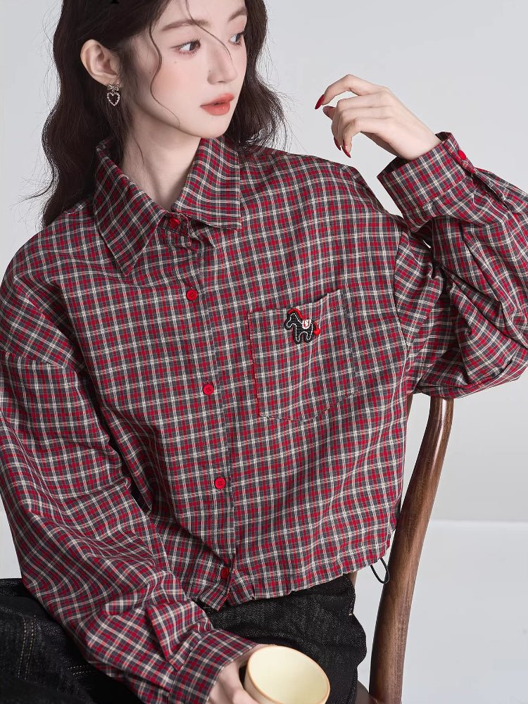 Front view of the woman in the plaid cropped shirt, highlighting the button-up front and drawstring hem.