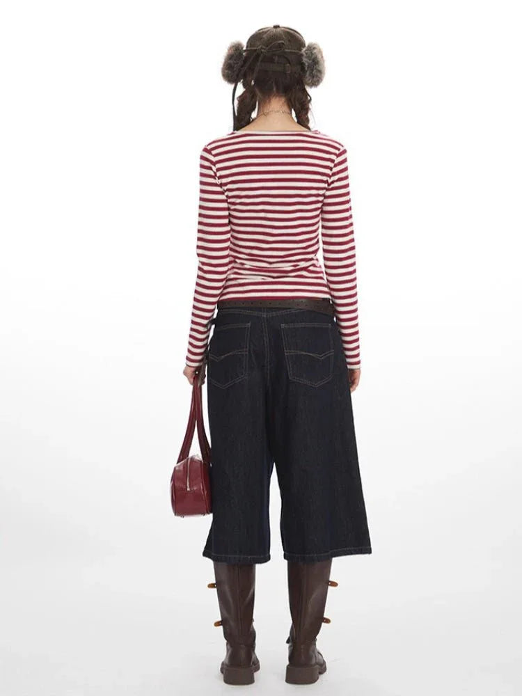Back view of a woman in a striped top and culottes