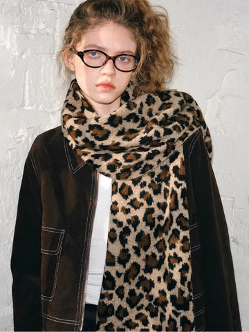 Woman wearing a leopard print knit scarf