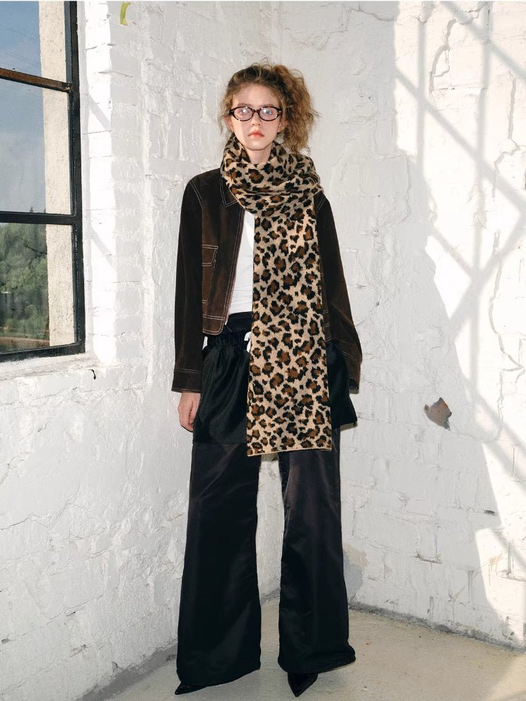 Woman wearing a leopard print knit scarf