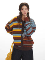 Close-up of a woman wearing a striped knit cardigan, showing the button-down front and a heart pendant necklace.