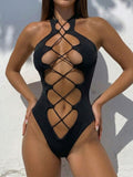 Black one-piece swimsuit with halter neck and criss-cross detailing on the front