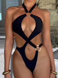 Black one-piece swimsuit with O-ring hardware and cut-out details