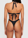 Front view of a black one-piece swimsuit featuring a halter neckline and O-ring accents
