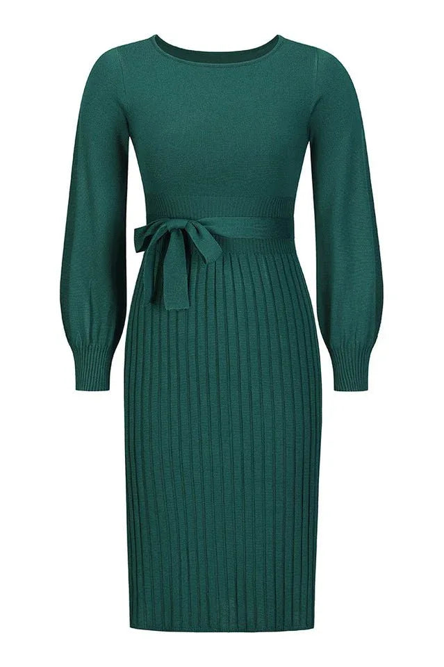 Front view of a green knit midi dress with a self-tie belt and pleated skirt
