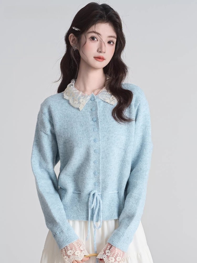 Woman wearing a light blue knit cardigan with a white lace collar and drawstring waist.