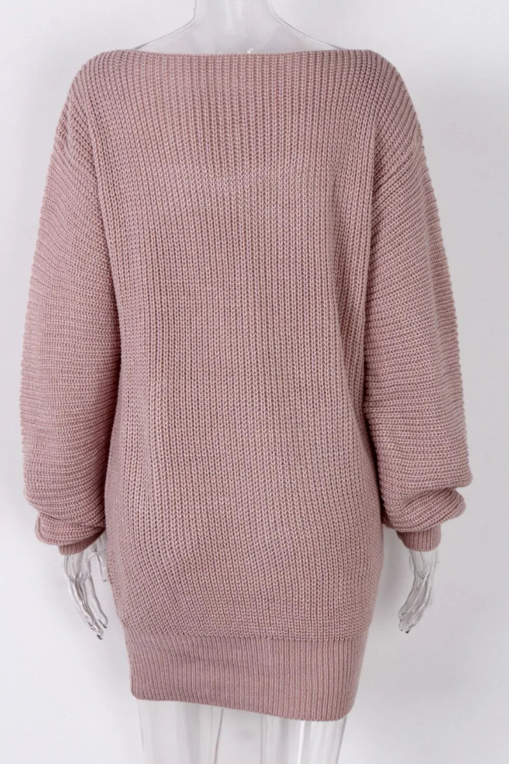 Mannequin displaying a pink off-the-shoulder knit tunic sweater, back view