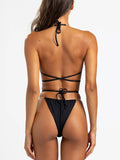 Back view of black triangle bikini top with gold chain accents and wrap-around ties
