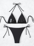 Flat lay of the reverse side of a black embellished triangle bikini set