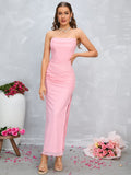 Full front view of a woman in a pink strapless ruched dress