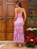 Back view of a woman in a pink floral print maxi dress.