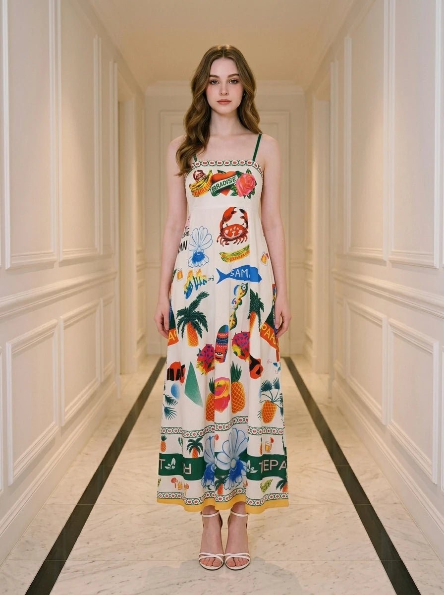 Woman wearing a white midi dress with a tropical print, standing in a hallway.