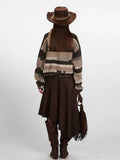 Back view of a woman in a striped knit sweater and a brown skirt