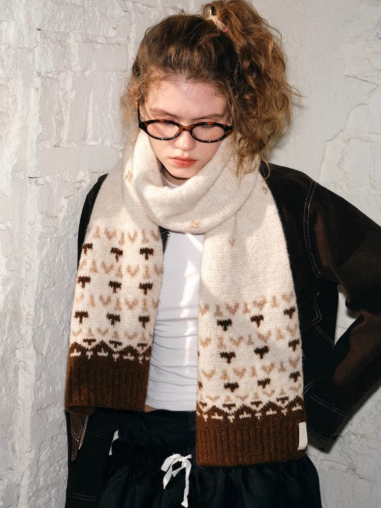 Model wearing a cream and brown Fair Isle knit scarf with a textured finish.