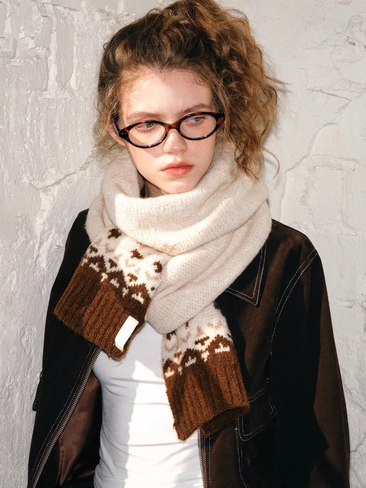 Model wearing a cream and brown Fair Isle knit scarf with a textured finish.