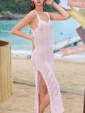Front view of a woman in a pink crochet knit maxi dress with a scoop neckline and tank straps