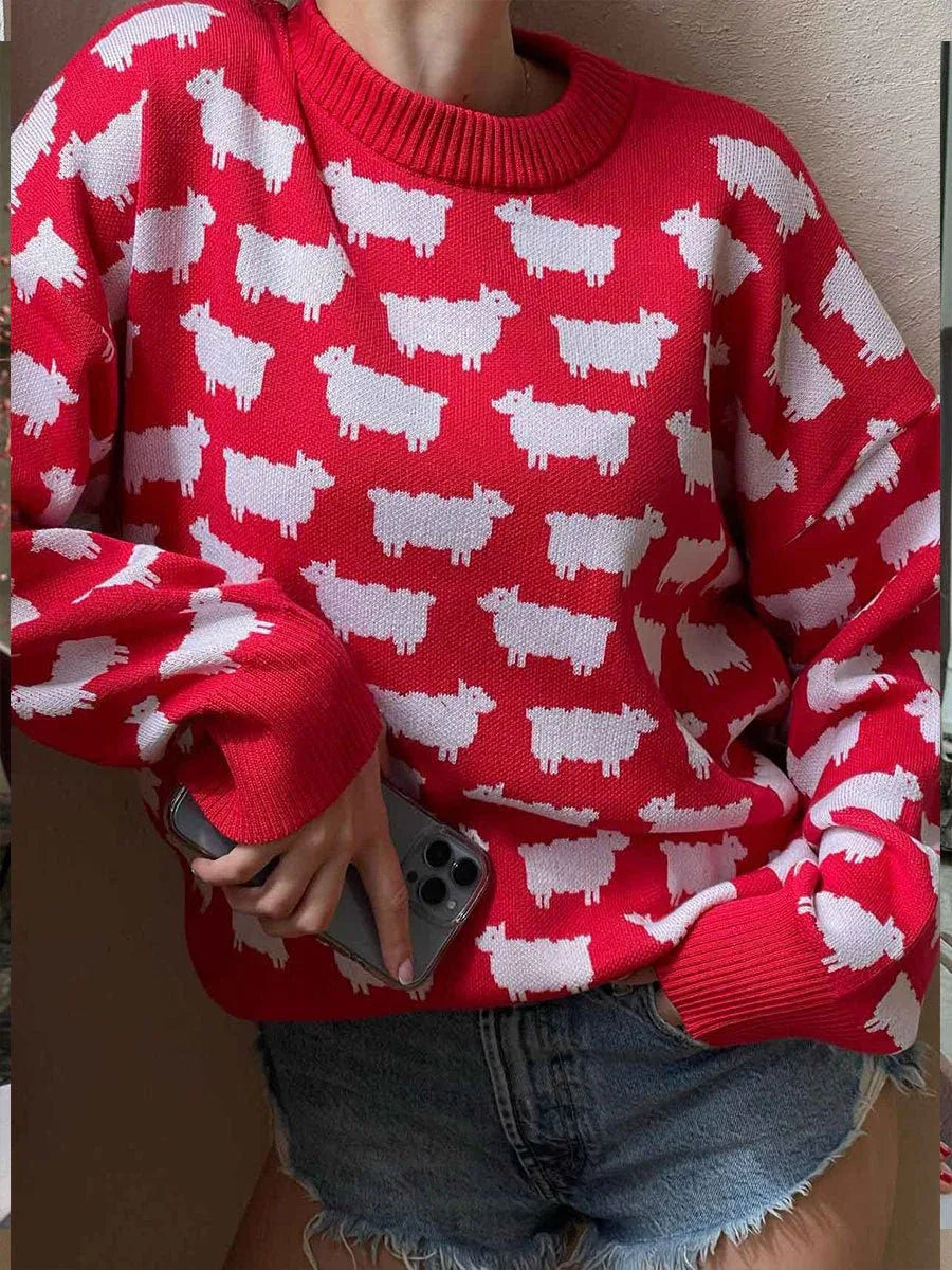 Woman wearing a red sweater with a white sheep pattern