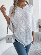 White V-neck knit poncho with cable knit and geometric open-knit detailing.