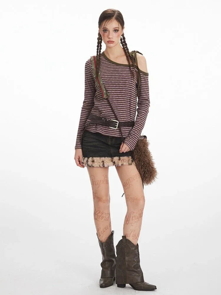 Full-length shot of a woman modeling a striped, off-the-shoulder top.