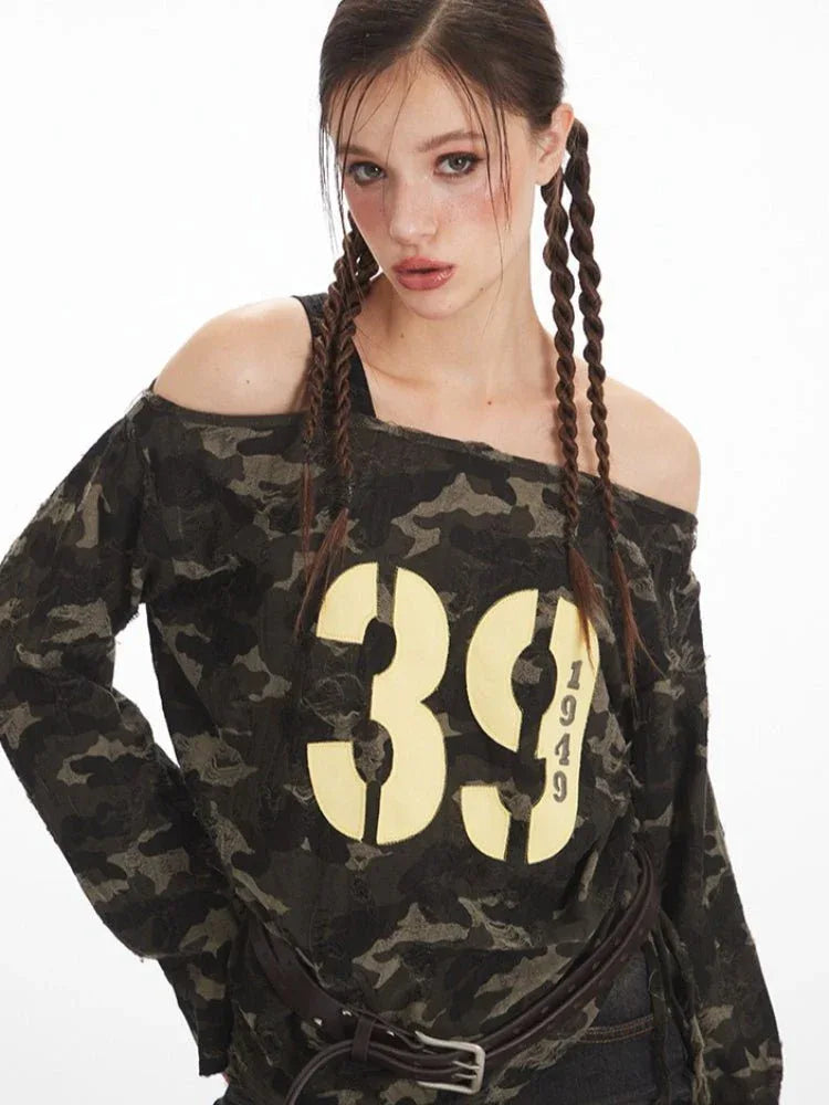 Detailed view of the graphic print on the camouflage off-shoulder top.