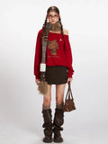Woman wearing a red off-the-shoulder sweatshirt with a Hello Kitty graphic, brown mini skirt, brown knee-high boots, and a leopard print scarf.