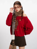 Woman adjusting glasses while wearing a red off-the-shoulder sweatshirt with a Hello Kitty graphic, brown mini skirt, and a leopard print scarf.
